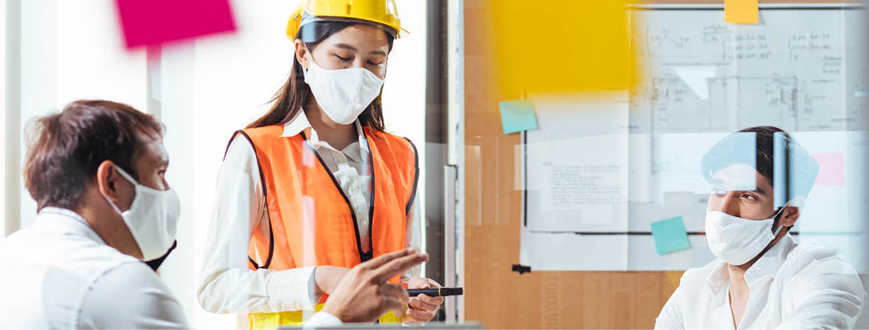 Group of creative building architect construction engineer project meeting and brainstorm together  Industry, Engineer, construction concept  Members wear face mask prevent covid-19 virus